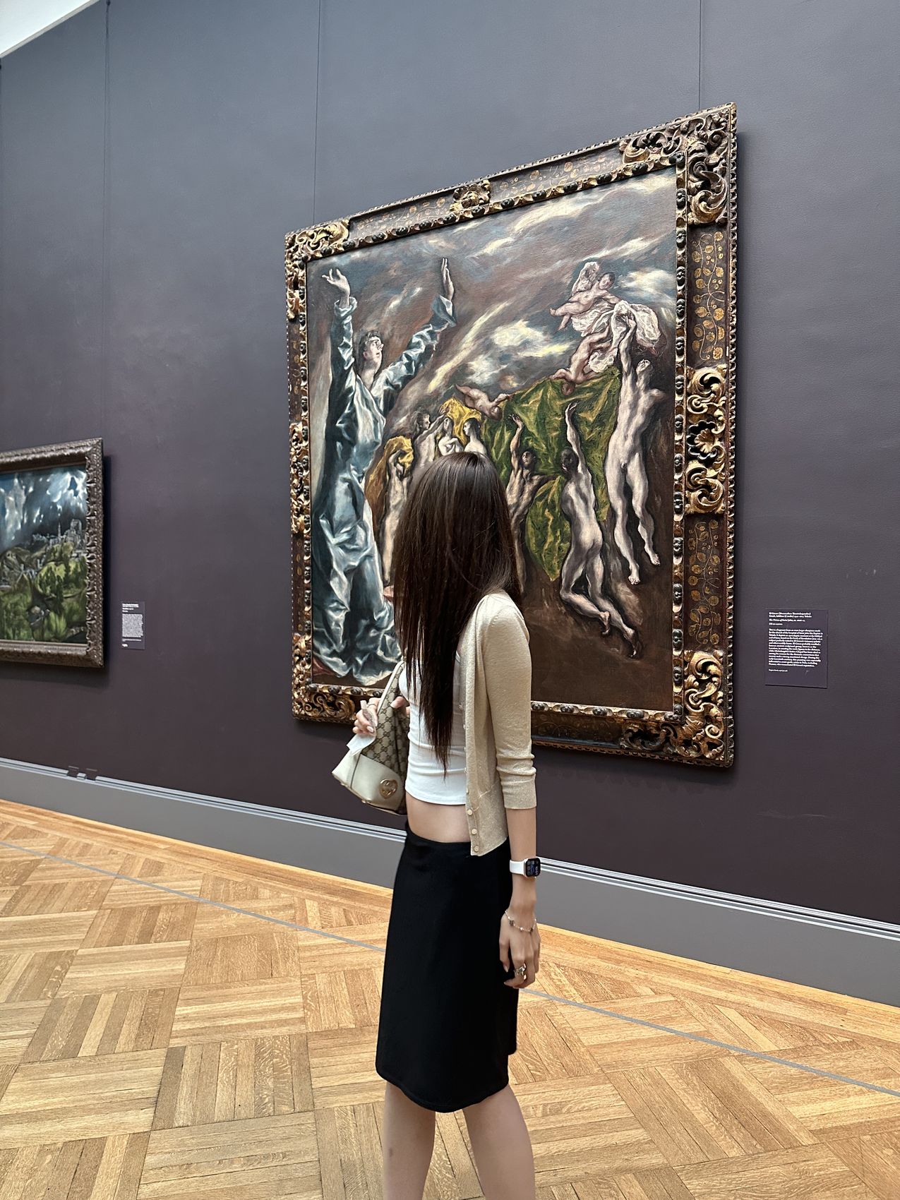 Looking at a large old-master painting in a gallery at the Metropolitan Museum of Art
