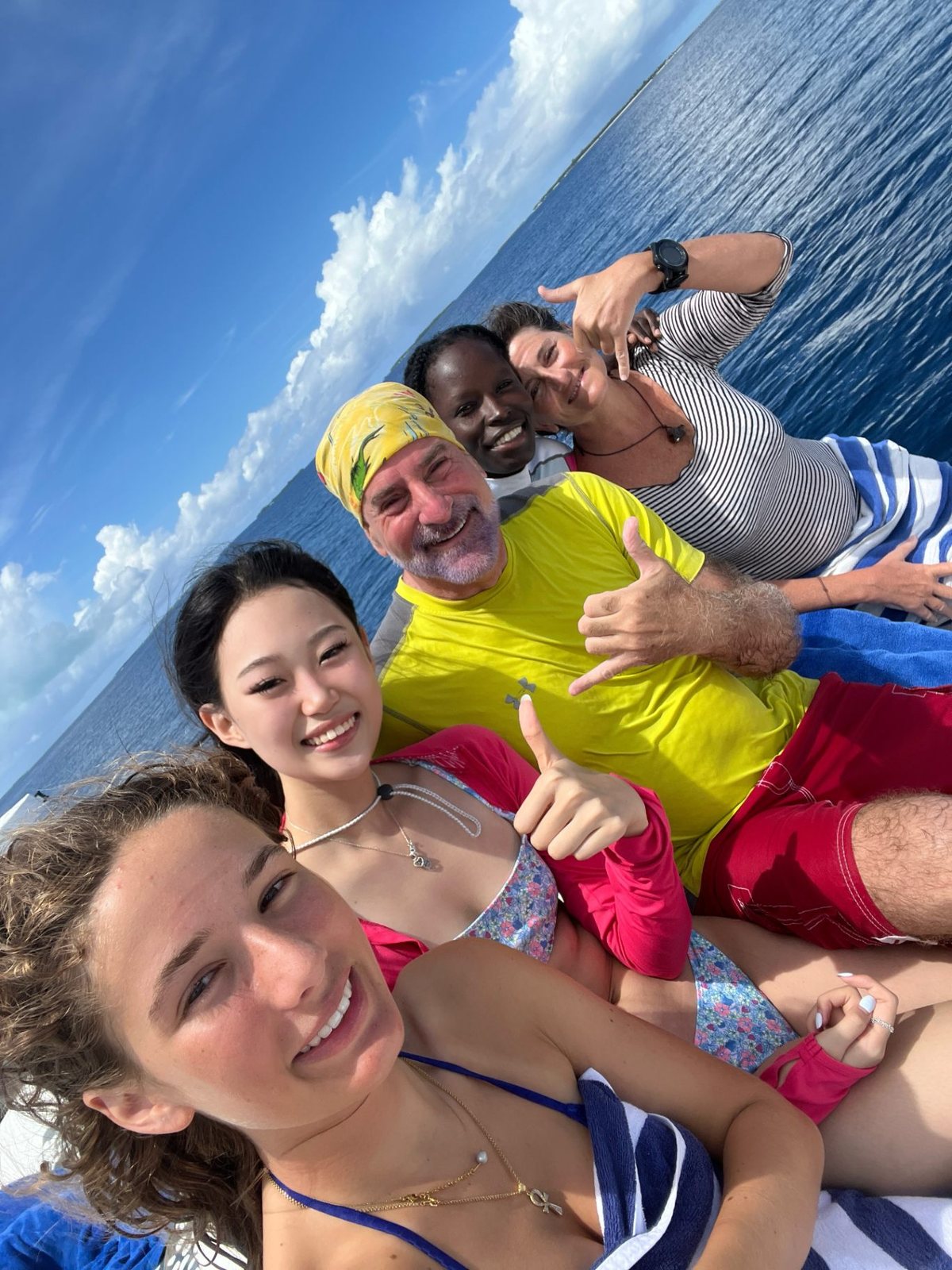 Dive group together on the boat between dives