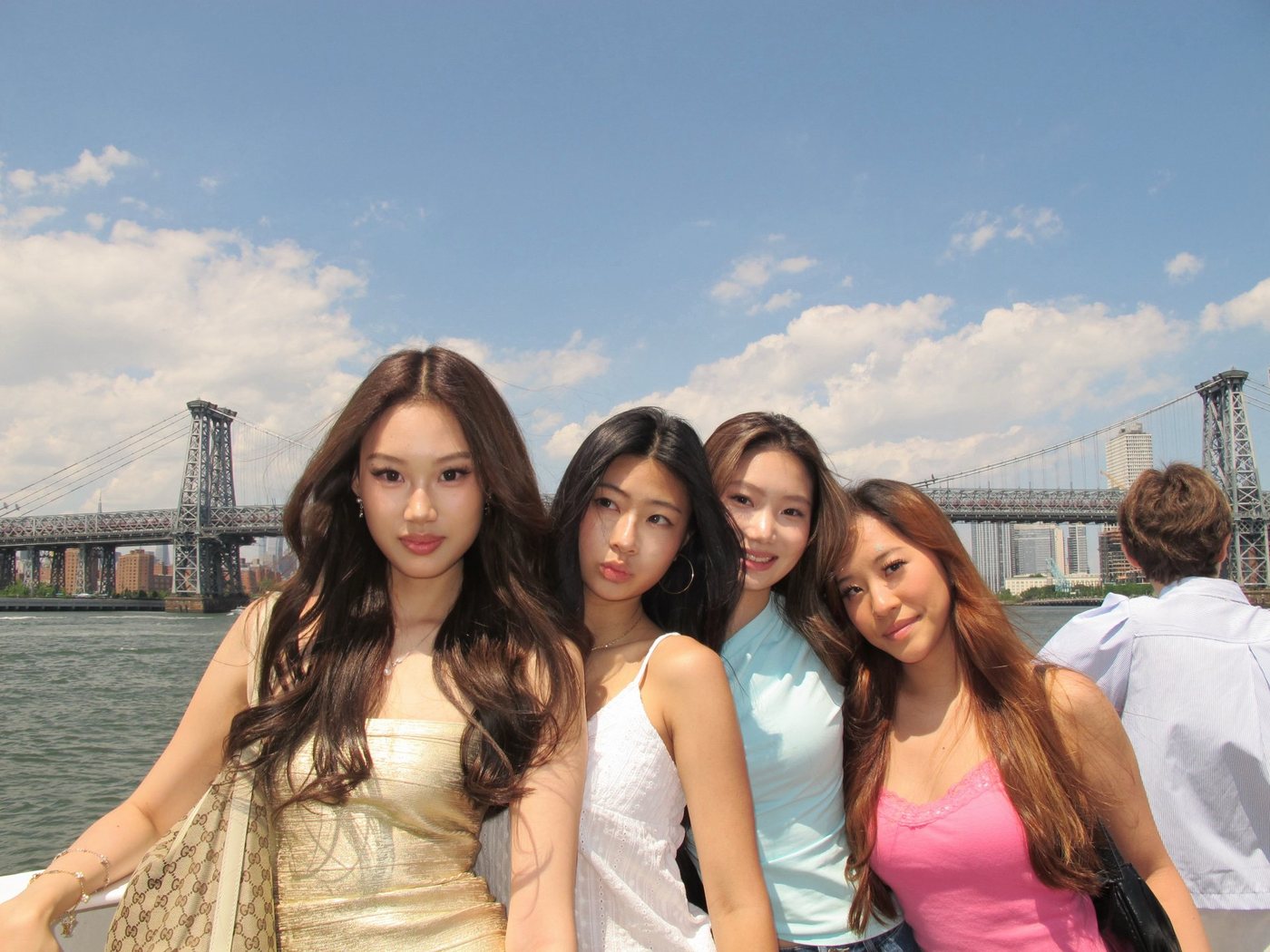 Four friends in front of the Manhattan Bridge