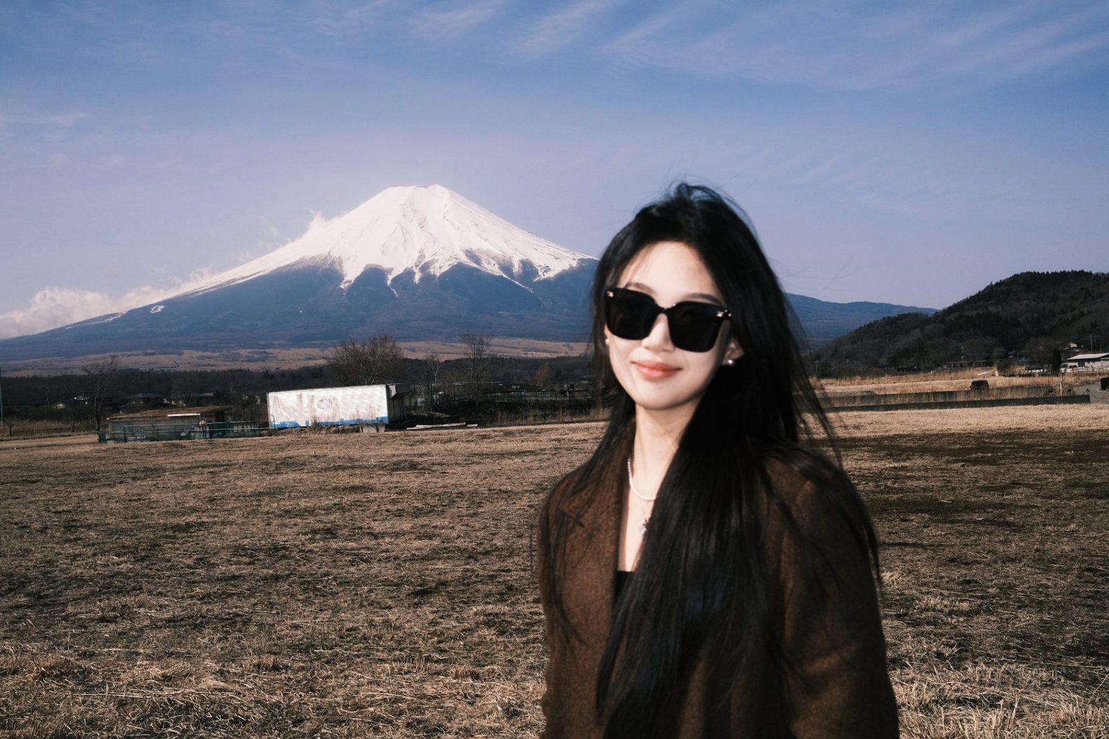 Mount Fuji behind a bare field in late winter
