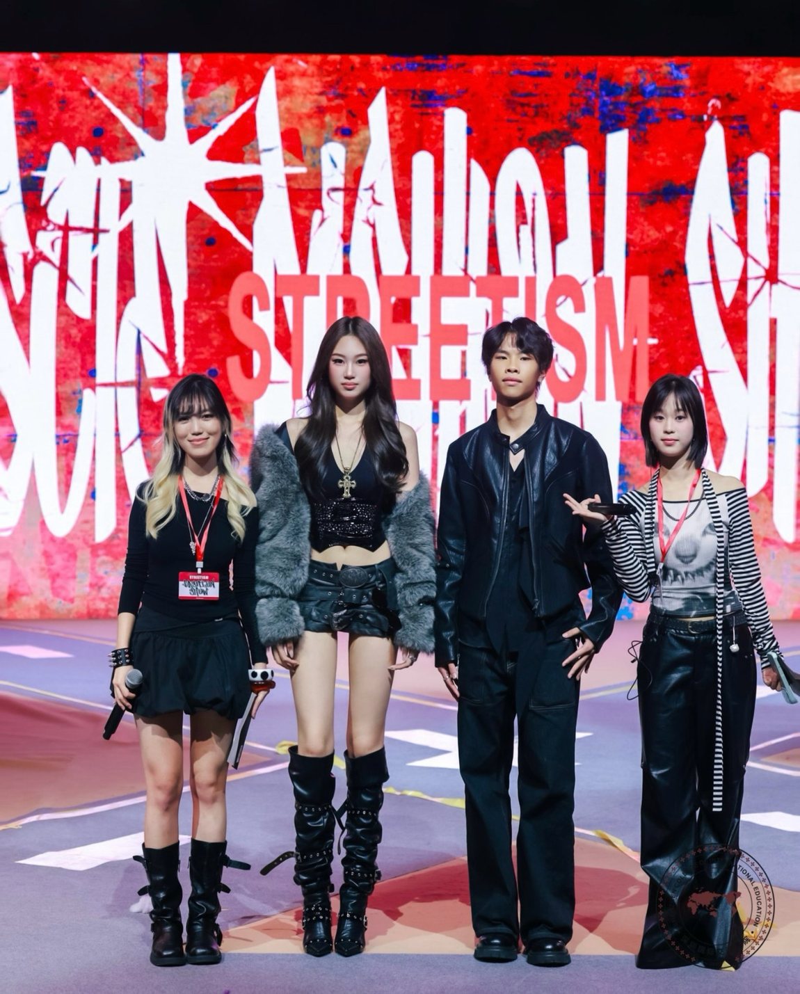 Four hosts on stage in front of the STREETISM backdrop